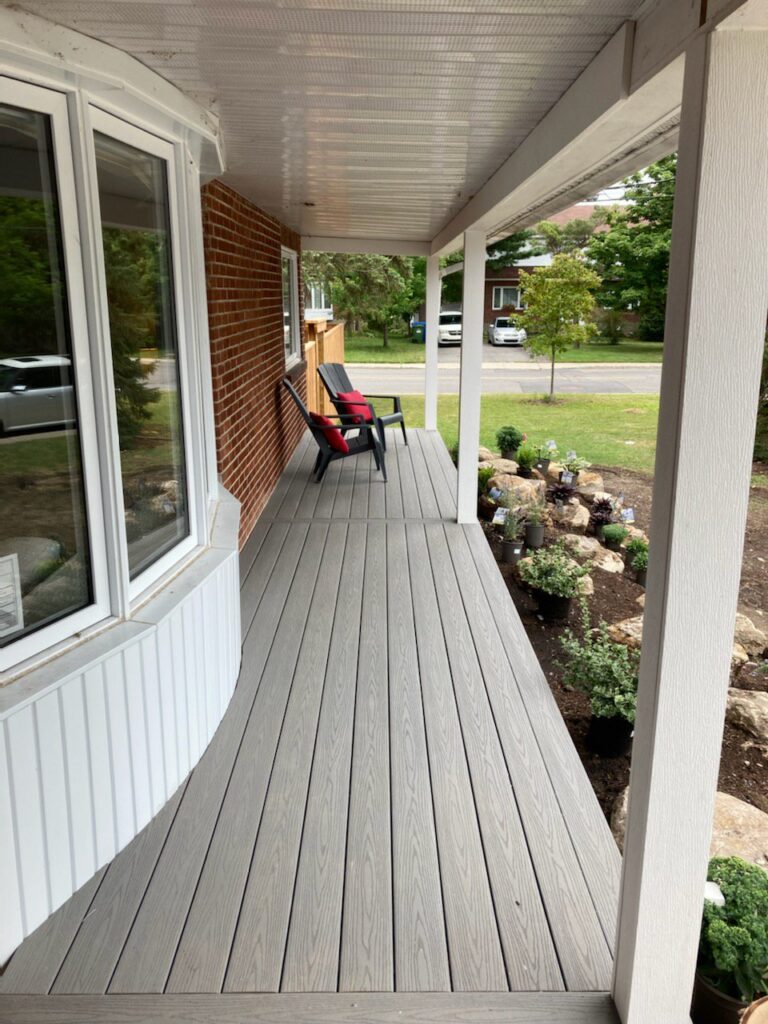 Exterior shot of a composite porch with PVC trimmed posts
